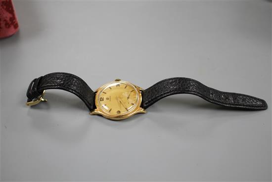 A gentlemans 1950s 18k yellow metal Omega manual wind wrist watch.